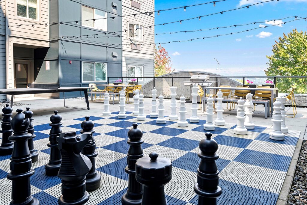 Courtyard with large chess game at VUE25, the best apartments in Tacoma